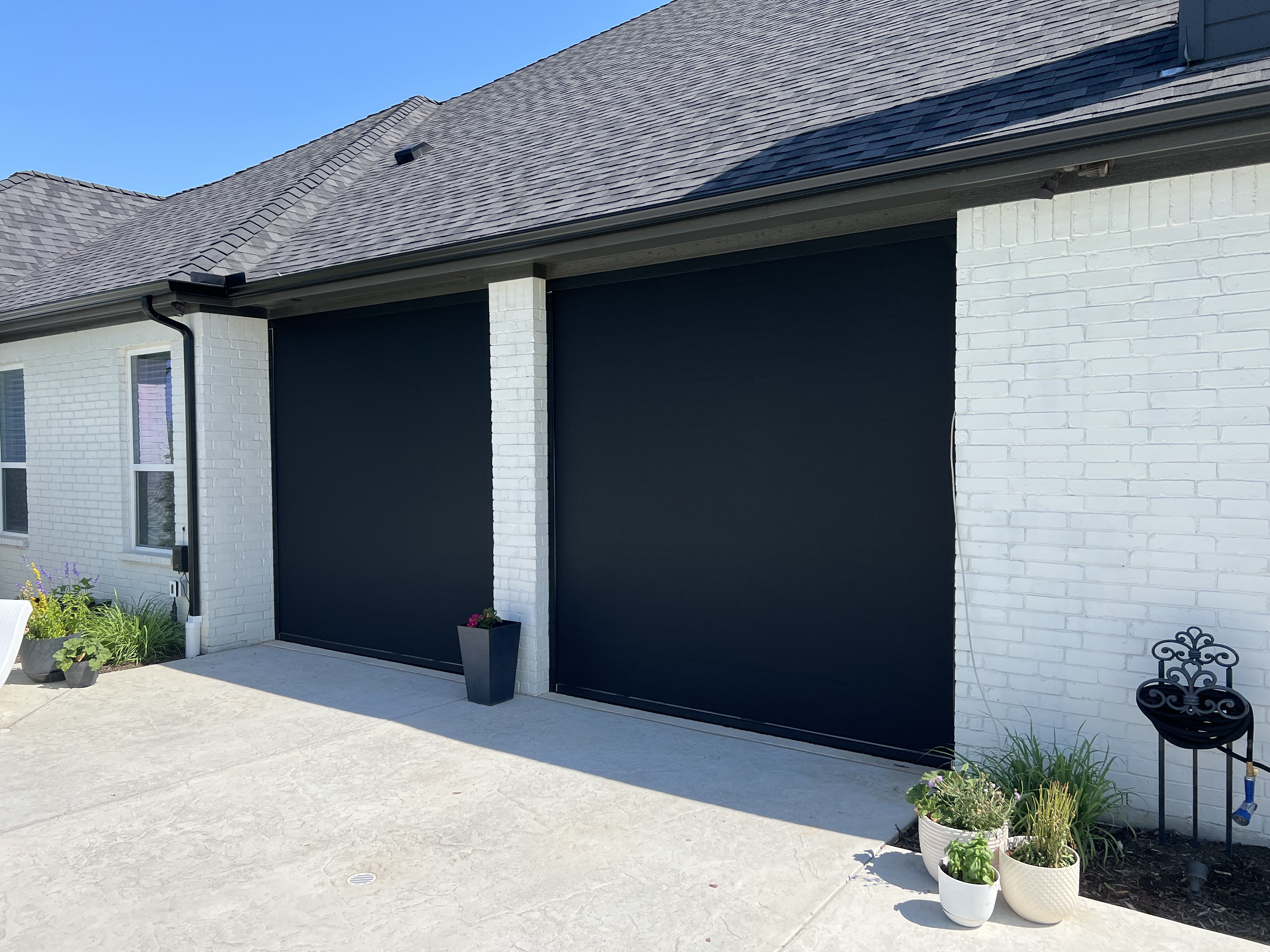 Patio enclosed on three sides by shades