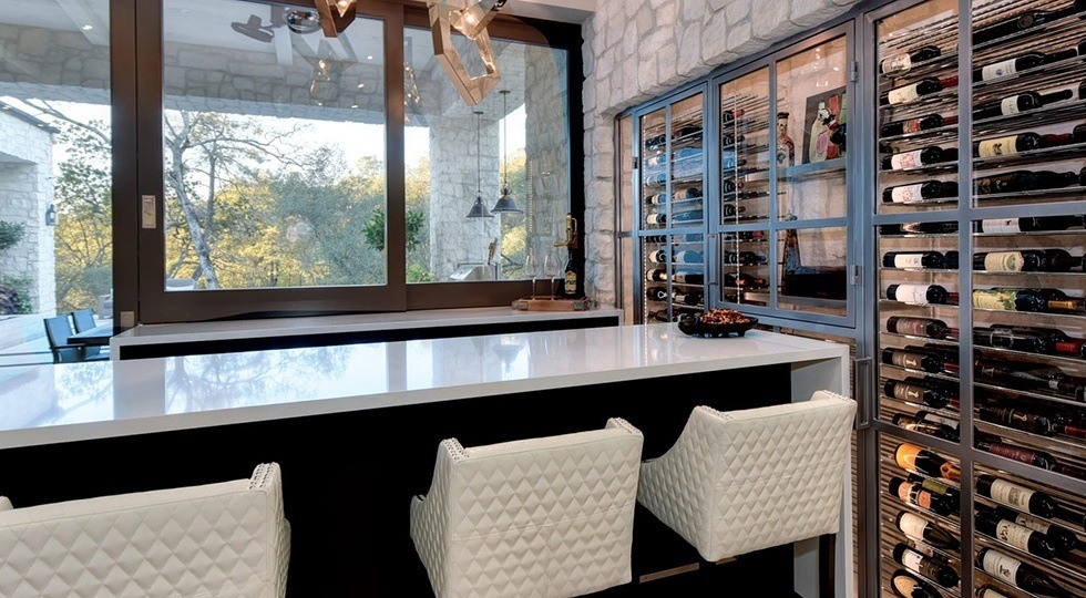 Beautiful kitchen with custom wine cellar along one wall
