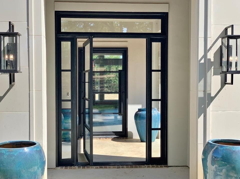 Home entrance with custom iron doors