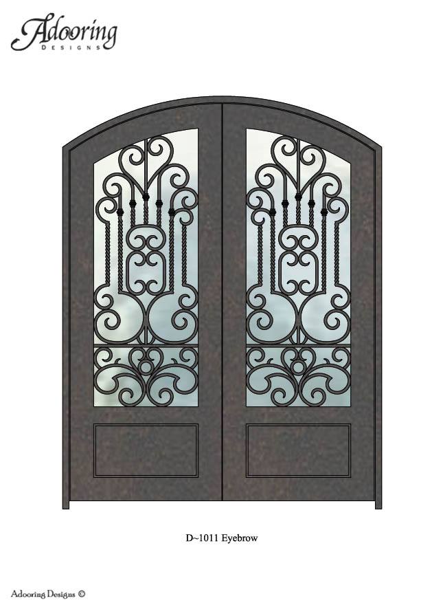 Large window in eyebrow top iron door with intricate pattern