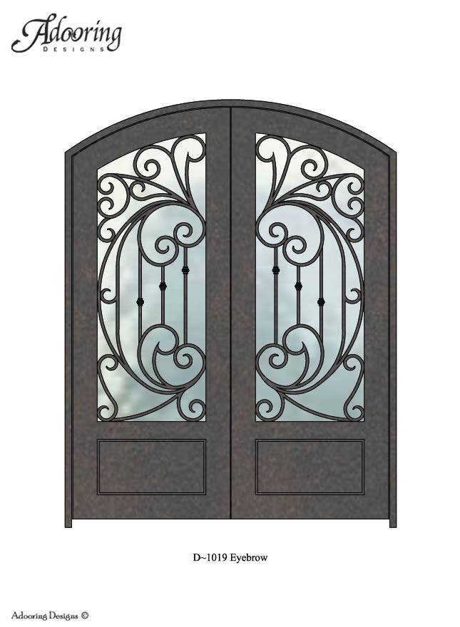 Large window in door with eyebrow top and intricate pattern