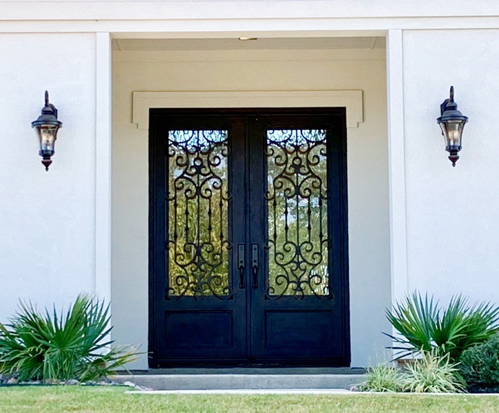Square top double front doors with black finish and intricate design