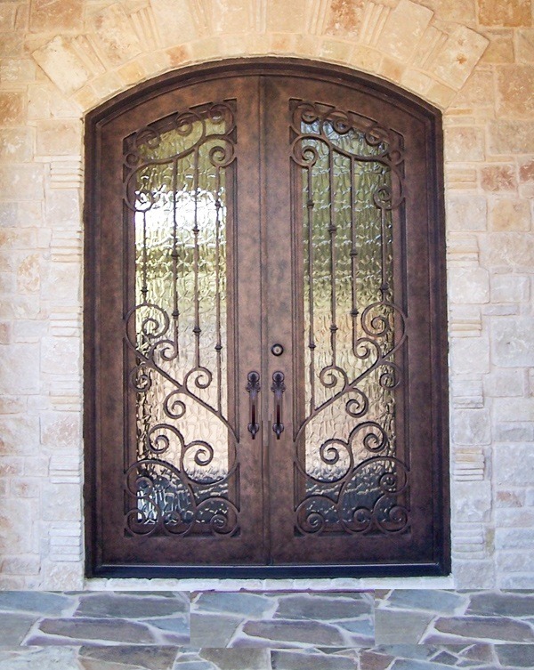 Eyebrow top double front doors with bronze finish