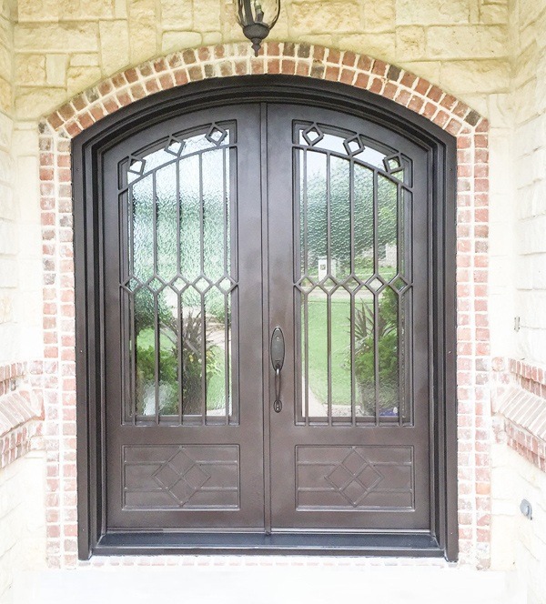 Beautiful copper double front door with eyebrow top