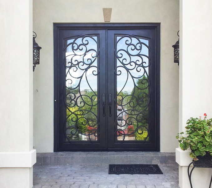 Square top double front door with black finish and custom iron work