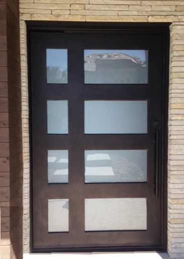 Iron door with four large windows and four smaller windows