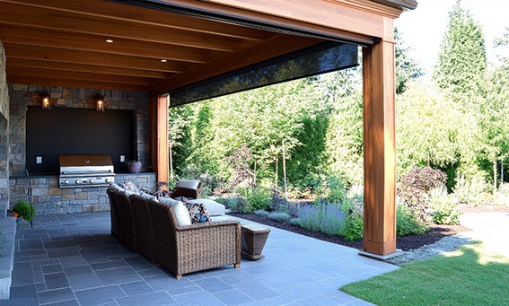 Outdoor patio space with motorized screens