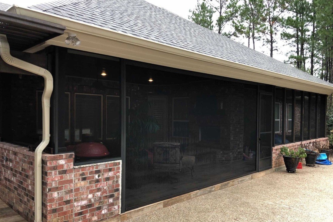 Patio enclosed on three sides by shades