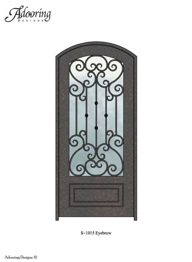 Large window in iron door with eyebrow top and intricate pattern