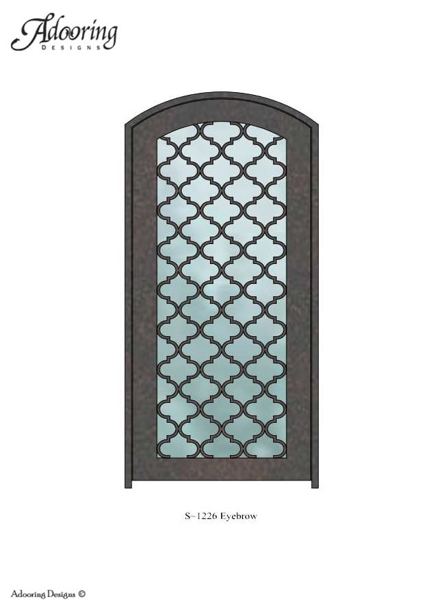 Intricate design on iron door with eyebrow top