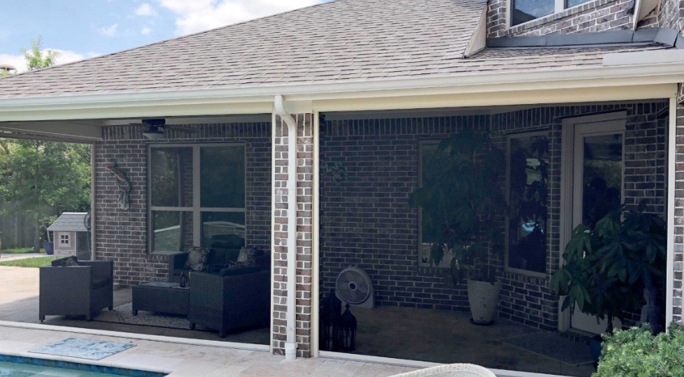 Exterior view of home with a lot of Motorized Screens