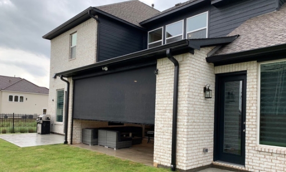 Patio enclosed by motorized screens system