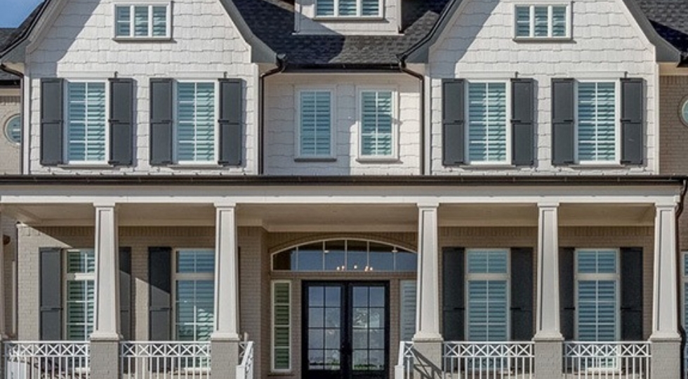 Exterior view of home with a lot of windows